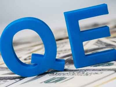 What is Quantitative Easing (QE) and its impact on financial markets